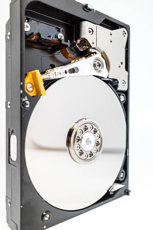 a screwed-on hard disk shows the inner workings of a hard diskの写真素材