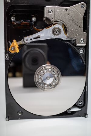 a screwed-on hard disk shows the inner workings of a hard diskの写真素材