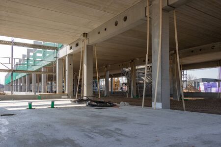 a huge company building is erected on a large construction site