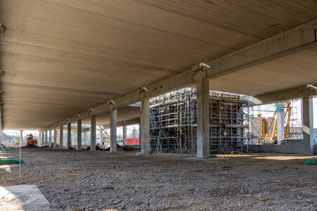 a huge company building is erected on a large construction site