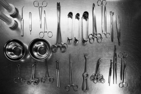 in  sterilization department many cleaned instruments lie on a metal tableの写真素材