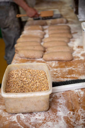 in a bakery the loaves of bread lie side by side on the table