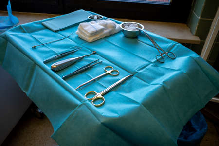 in an operating room there is an instrument table with surgical instrumentsの写真素材