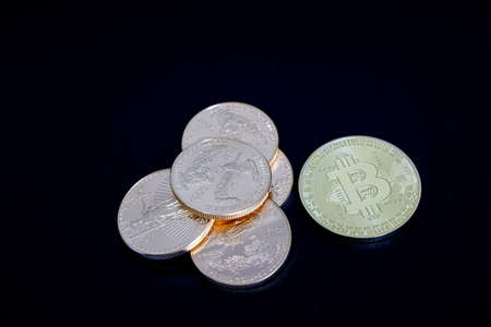 one gold Bitcoin coin is worth 10000 dollars to one stack of gold dollars