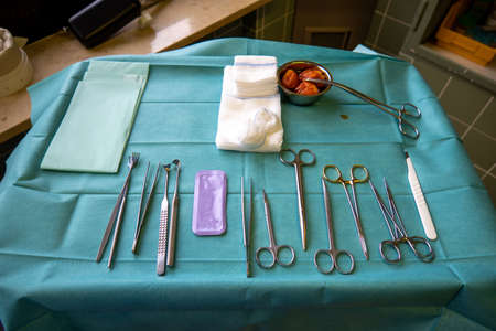surgical instruments on a small instrument table for performing an operationの写真素材