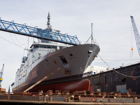 A frigate is being repaired in a dry dock at Blohm and Voss in Hamburgのeditorial素材