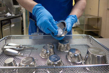 in a sterilization department in an operating room, instruments are sorted and cleaned