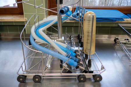 in a sterilization department of a hospital, anesthesia tubes are cleaned in a washing machineの写真素材