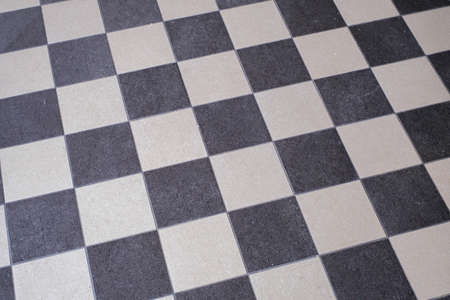 the black and white chess pattern of a floor