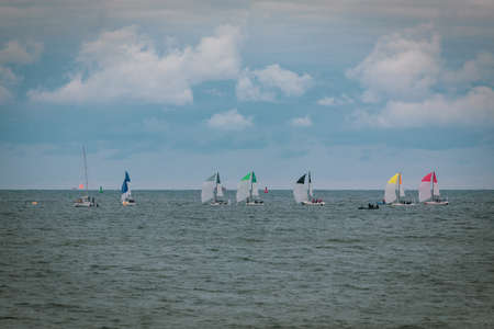 A sailing regatta takes place on the seaの写真素材