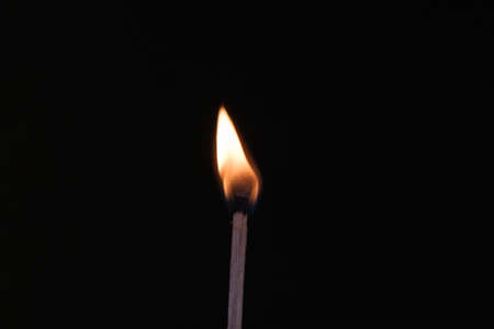 a close up of a burning match