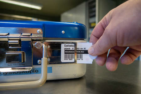 in a sterilization department, a label is attached to an instrument containerの写真素材