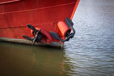 on the red ship there are two anchors