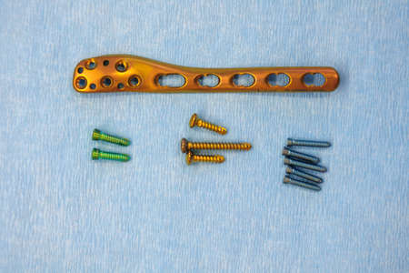 a titanium surgical plate and titanium screws for the treatment of a tibia fracture