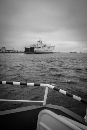 a large ferry leaves the port of Rostockのeditorial素材