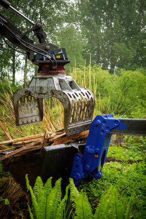 Debris is removed with an excavator and a wheel loader
