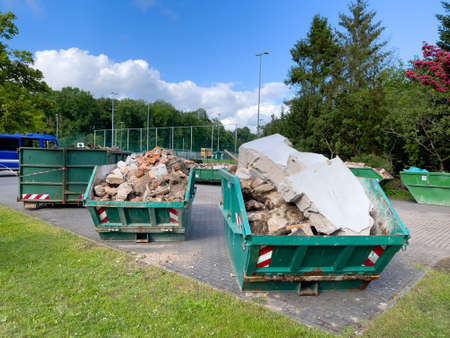 in large containers there is the waste from a house demolition