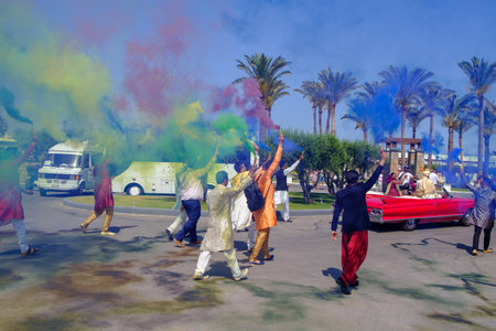in front of the hotel there is a colorfully dressed indian wedding partyのeditorial素材