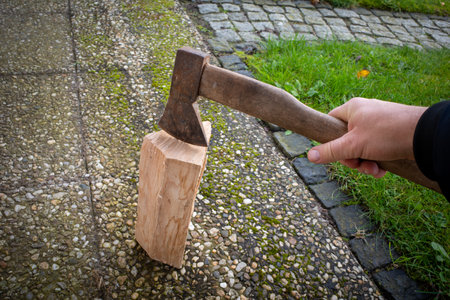 one piece of wood is split with an axeの写真素材