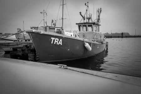old fishing boat lying in the harbor of Luebeck Travemuendeの写真素材