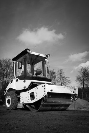 a big bulldozer stands on the sports fieldの写真素材