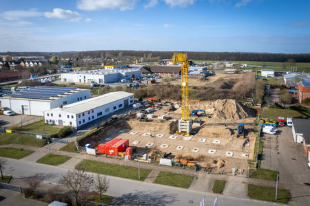 on a construction site large foundations are poured for the pillars of a factory buildingの写真素材