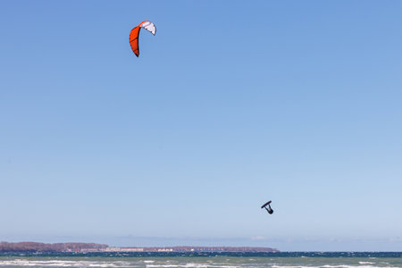 a kitesurfer surfing in stormy weather on the baltic seaの写真素材