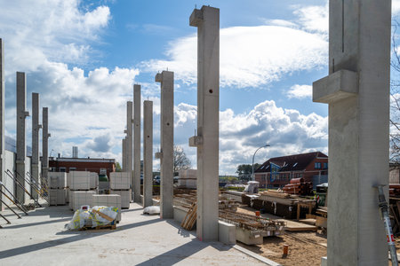 many concrete pillars for a factory building are erected on a construction siteの写真素材