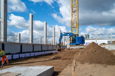 many concrete pillars for a factory building are erected on a construction site
