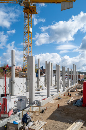 many concrete pillars for a factory building are erected on a construction siteの写真素材
