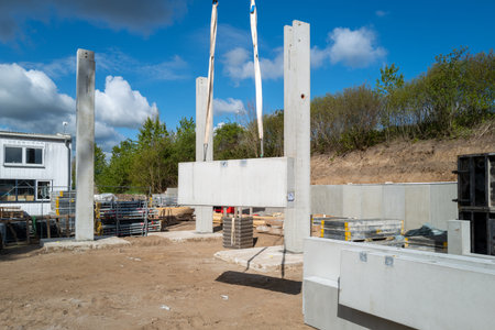 many concrete pillars for a factory building are erected on a construction siteの写真素材