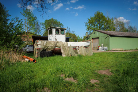 An old fishing boat lies ashoreの写真素材