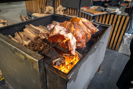 thick ham is grilled on open fireの写真素材