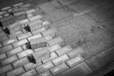 many paving stones are laid for a new sidewalkの写真素材