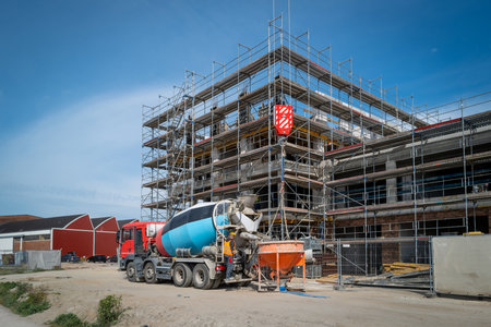 on a large construction site concrete is delivered in a concrete mixerの写真素材