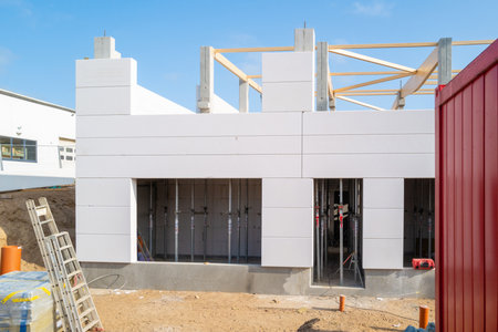 A new factory building is erected on a construction siteの写真素材