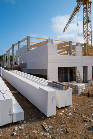 A new factory building is erected on a construction siteの写真素材