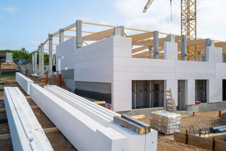 A new factory building is erected on a construction siteの写真素材