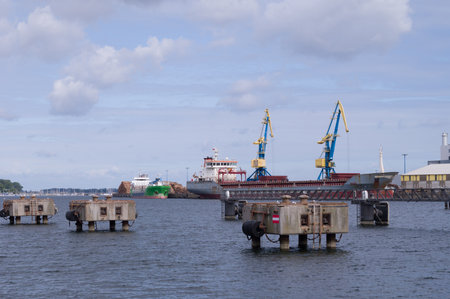 Logs are loaded onto a ship in the Wismar timber harborの写真素材