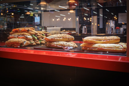 in the display of a bakery are various bread for saleの写真素材