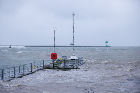 Due to a heavy storm tide parts of the harbor of Travemuende are under waterの写真素材