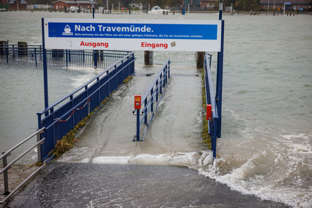Due to a heavy storm tide parts of the harbor of Travemuende are under waterの写真素材