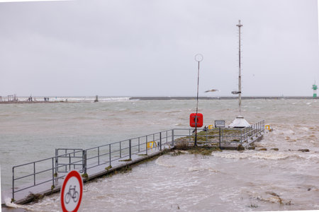 Due to a heavy storm tide parts of the harbor of Travemuende are under waterの写真素材