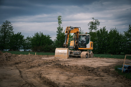 There is a large excavator on a building site