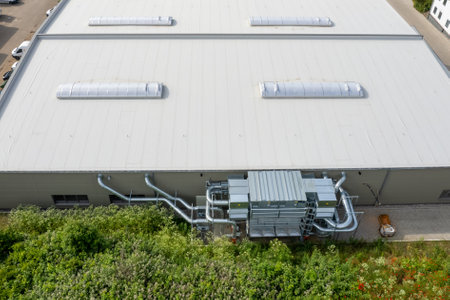 A ventilation and air conditioning system is attached to a factory buildingの写真素材
