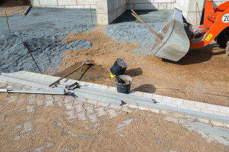a square in front of a hall is paved with cobblestonesの写真素材