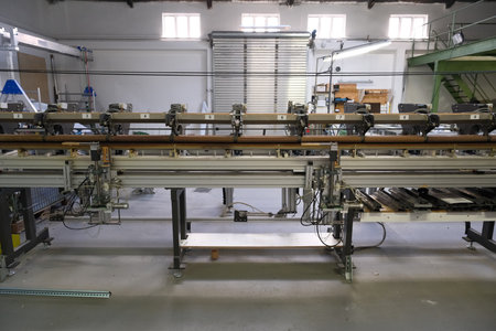a complex machine stands in a factory hallの写真素材