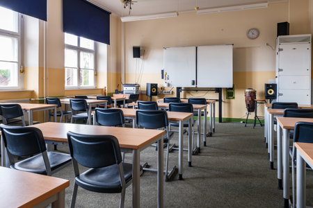 A classroom full of tables and chairsの写真素材