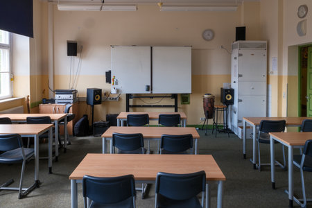 A classroom full of tables and chairsの写真素材