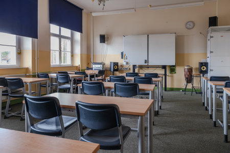 A classroom full of tables and chairsの写真素材